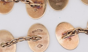 A pair of early to mid 20th century Austro Hungarian yellow metal and two colour enamel set oval cufflinks and a pair of 1930's engine turned 9ct gold oval cufflinks, gross weight 22 grams. Condition - fair